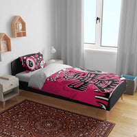 Pink bedding set with black-and-white eagle graphic and two matching pillowcases