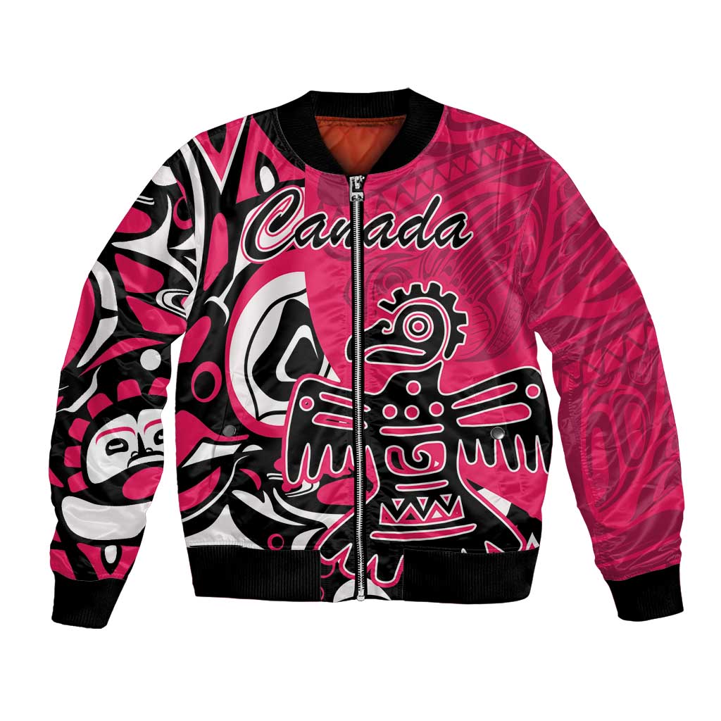 Pink bomber jacket with front zipper, Canada text, and Haida eagle-style graphic.