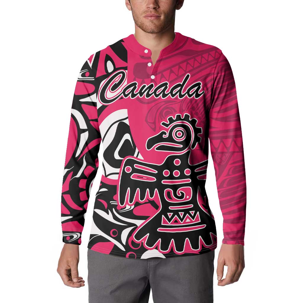 Pink button-front sweatshirt worn, featuring Haida eagle front graphic with Canada script