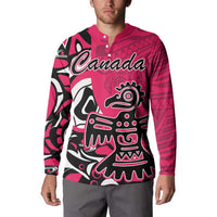 Pink button-front sweatshirt worn, featuring Haida eagle front graphic with Canada script