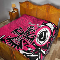 Pink quilt blanket on wooden bed, black and white eagle graphic with 'Your Text'