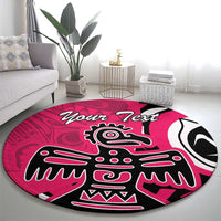 Pink round area rug with Haida-style eagle graphic and 'Your Text' lettering