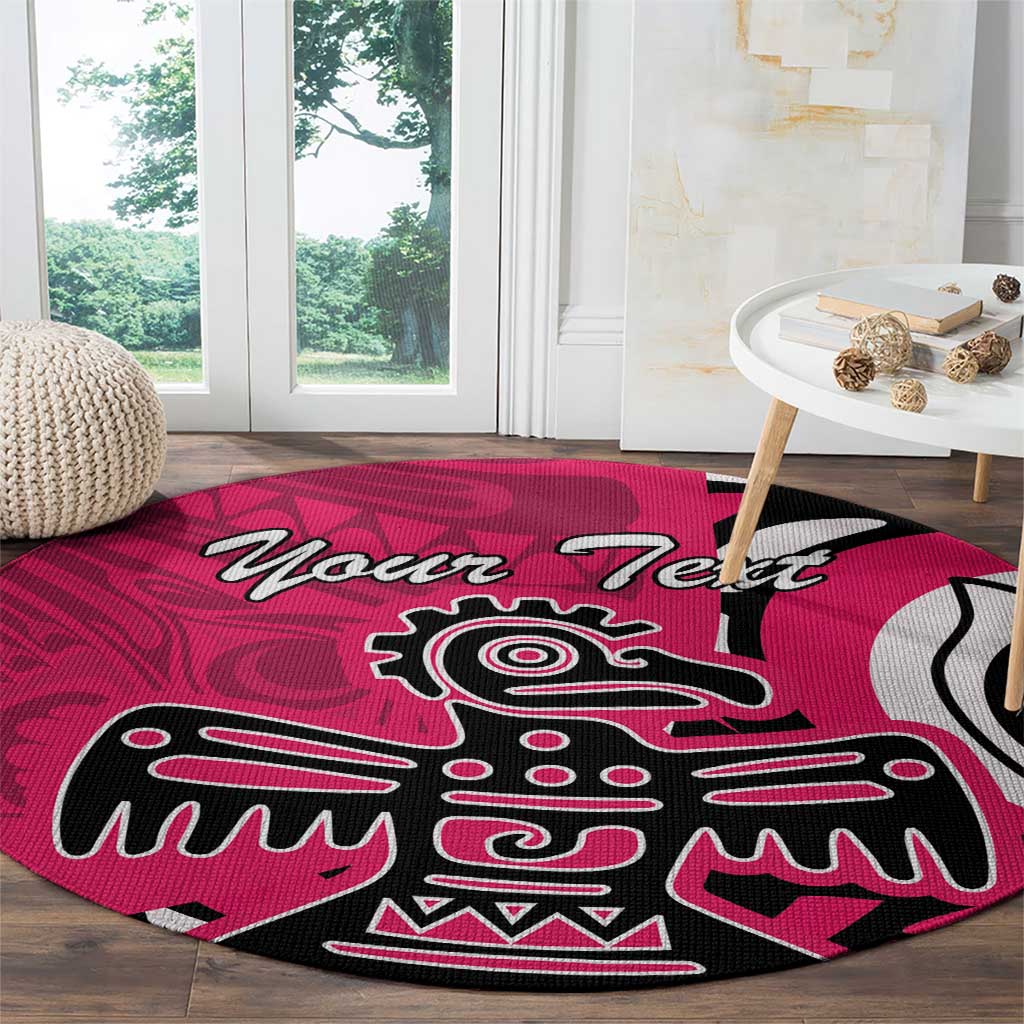 Pink round rug featuring large Haida-style eagle emblem and 'Your Text' text