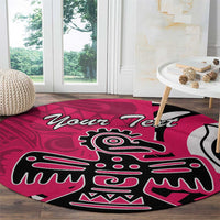 Pink round rug featuring large Haida-style eagle emblem and 'Your Text' text