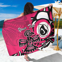 Pink sarong viewed from back with 'Your Text' and large eagle head motif
