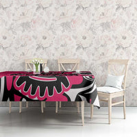 Pink patterned tablecloth with black-and-white eagle motif on dining set