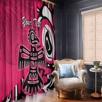 Pink window curtain with black-and-white eagle graphic, draped beside upholstered chair