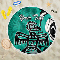 Turquoise round beach blanket with fringe, eagle graphic and 'Your Text' text, flat lay