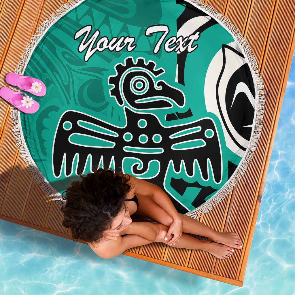 Turquoise round beach blanket with fringe, eagle graphic and 'Your Text' text on deck