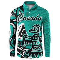 Turquoise button sweatshirt with Haida eagle graphic and 'Canada' script