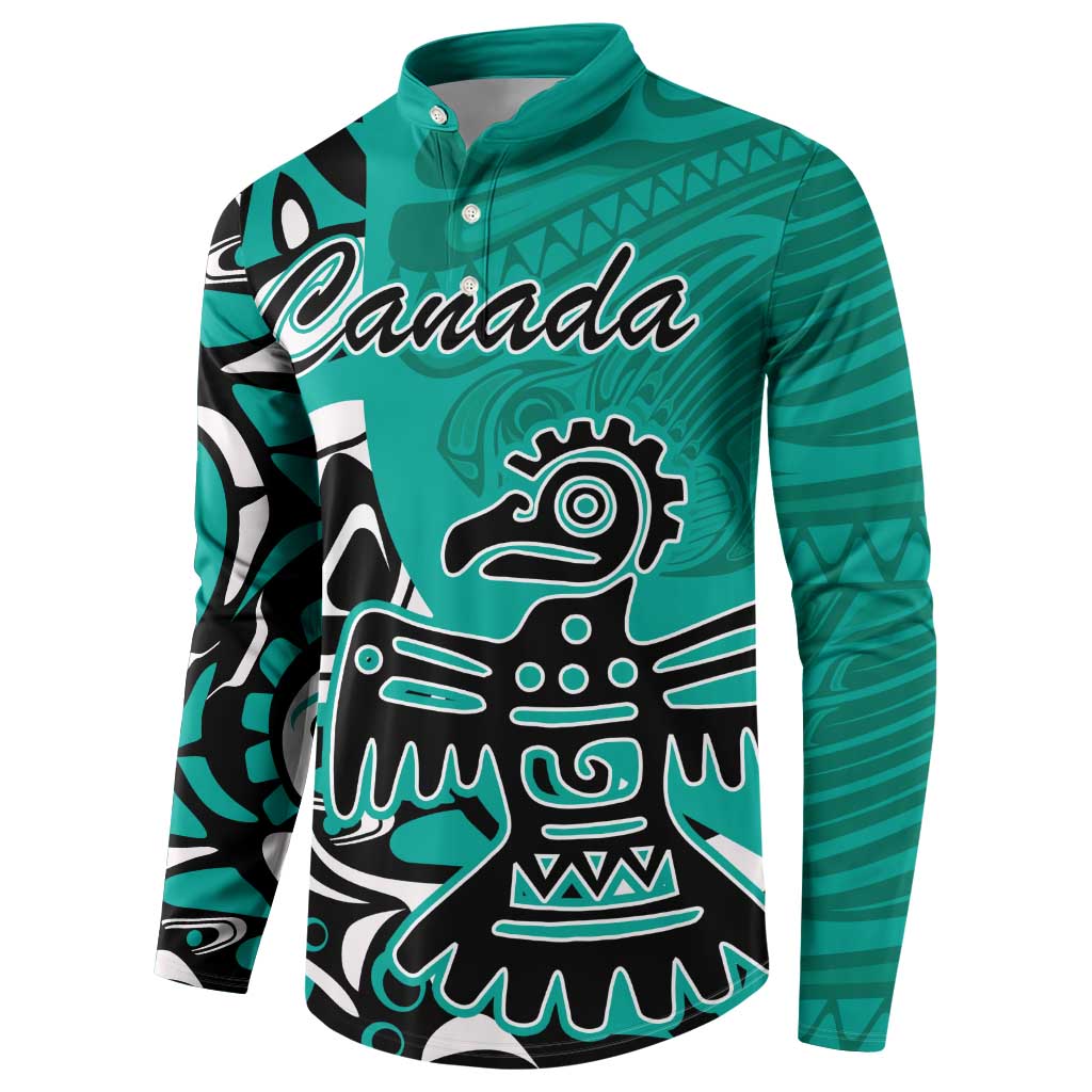 Turquoise button sweatshirt with large Haida-style eagle graphic and 'Canada' text