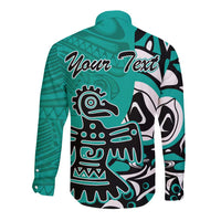 Turquoise long-sleeve button shirt with eagle face graphic and editable text area, tribal print.