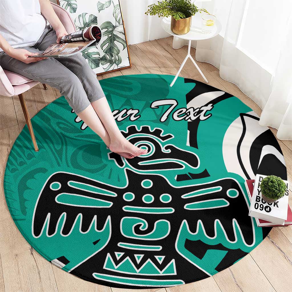 Turquoise round rug shown in use, with black and white eagle artwork and 'Your Text'.