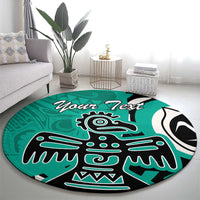 Turquoise round area rug with black and white eagle graphic and 'Your Text' lettering.