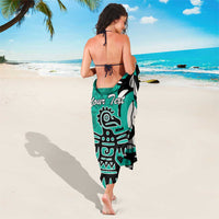 Turquoise sarong towel-style wrap with eagle/Haida pattern and centered “Your Text”
