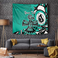 Turquoise wall tapestry with Haida eagle motif and 'Your Text' text, bold black and white shapes.