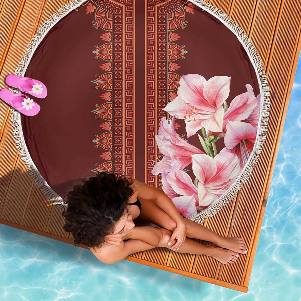 Round beach blanket laid flat, burgundy dashiki stripe center and pink lily corner, fringe