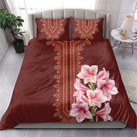 Burgundy bedding set with red dashiki center panel and pink lily floral on duvet