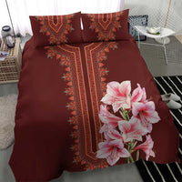 Burgundy duvet with red dashiki stripe and pink lily bouquet, plus matching pillowcases