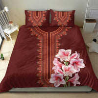 Burgundy bedding set with red dashiki panel trim and pink lily floral on duvet