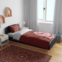 Burgundy bedding set with red dashiki stripe center and pink lily floral on duvet