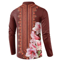 Maroon button sweatshirt with ornate vertical border and large pink lily floral print