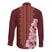 Maroon long-sleeve button shirt with geometric panel and pink lily print on back