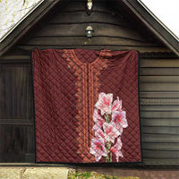 Wine-red quilt blanket with diamond stitching, embroidered center stripe and pink lilies
