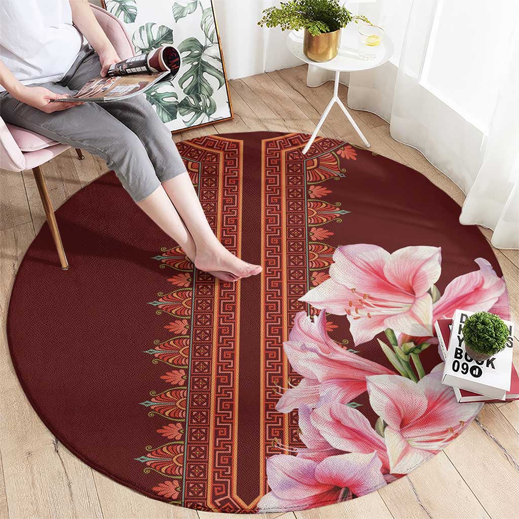 Round burgundy carpet with red patterned vertical band and pink lilies on right
