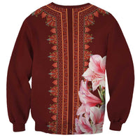 Red dashiki sweatshirt with vertical trim and pink lily print, back