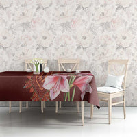Red tablecloth with pink lily floral print across table in living room