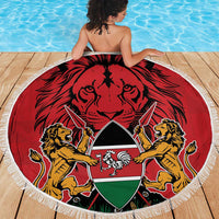 Round red beach blanket with lions-and-shield emblem, white fringed border on deck