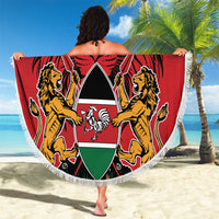 Round red beach blanket with lions-and-shield coat of arms, fringe border cape-style