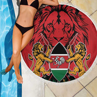 Round red beach blanket with lions-and-shield emblem, white fringed edge by pool