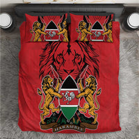 Red duvet and matching pillows with lion crest and coat of arms emblem graphic