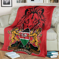 Red Kenya coat of arms blanket with lion graphic and Harambebe emblem, on couch