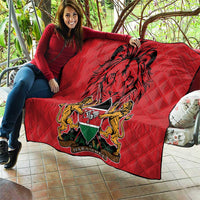 Red quilt with Harambe coat of arms and black lion graphic on diamond quilting