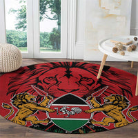 Red round carpet with large coat of arms crest and lions, kente-style pattern