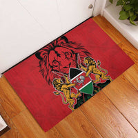 Red rubber doormat with lion crest graphic and Kenya shield on wooden floor