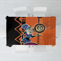 Orange tablecloth laid flat showing central woman figure, black and teal symbols
