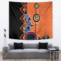 African woman ethnic dress tapestry with orange-and-black geometric pattern and circular motifs