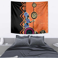 African woman ethnic dress tapestry with orange background, black shapes, and patterned headdress