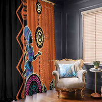 Window curtain pair with black and orange ethnic figure artwork and circular motifs