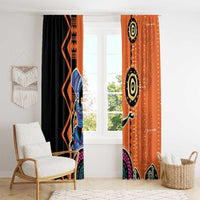 Window curtain set with black and orange geometric prints and central figure motif