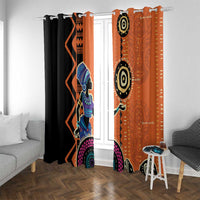 Window curtain pair with black and orange geometric patterns and eye-like circular motifs