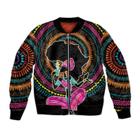 Black bomber jacket with colorful circular African-inspired front graphic, ribbed zipper collar