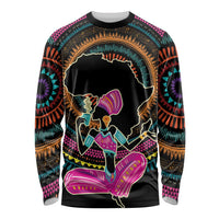 Black long-sleeve shirt with colorful African graphic of a woman dancing