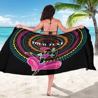 Black personalized sarong with 'YOUR TEXT' circular artwork, worn around shoulders