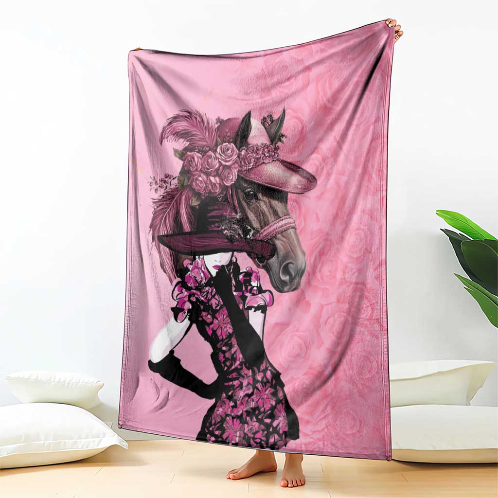 Pink throw blanket featuring a horse and derby rider with roses graphic