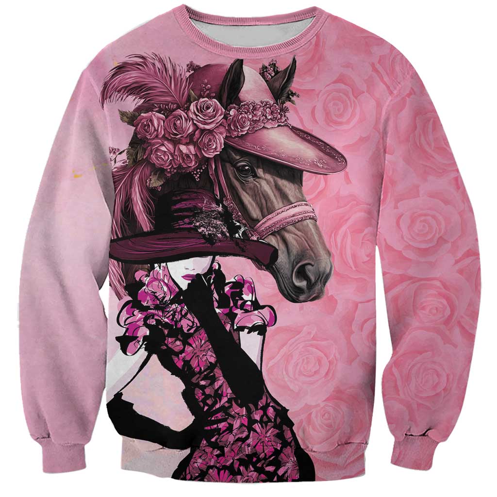 Pink crewneck sweatshirt with pink roses, racehorse and rider graphic on front